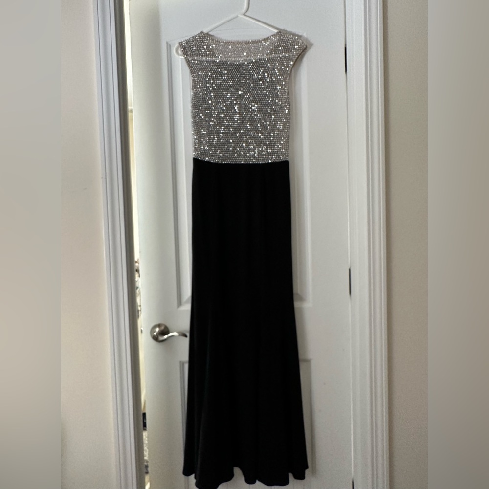 Floor length black dress with beaded see through back